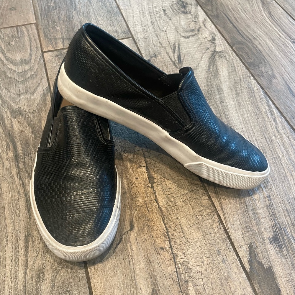 Restricted Black and White Leather Flats